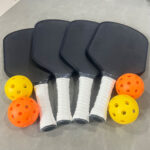 A variety of pickleball paddles showcasing different materials and designs