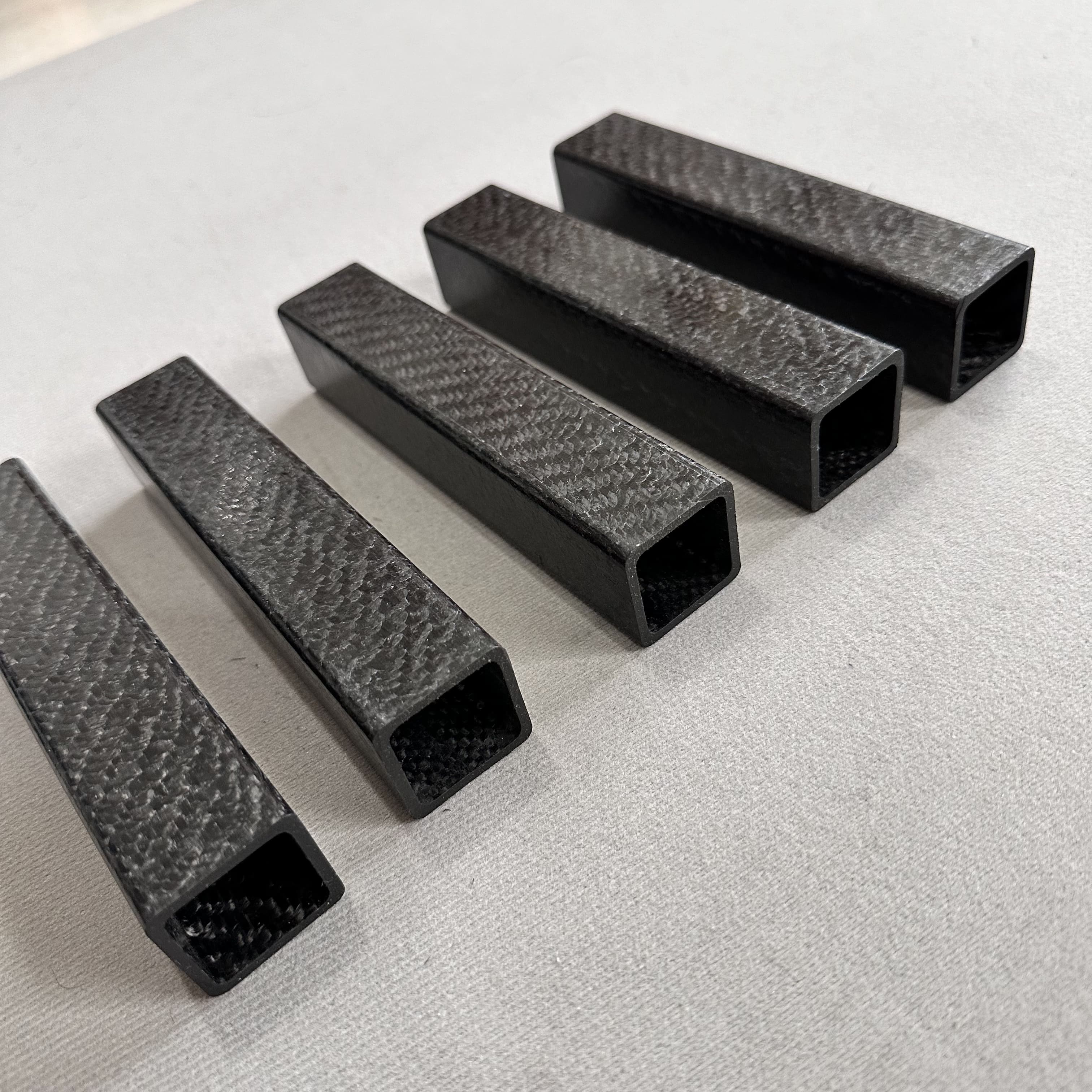 High-quality carbon fiber tube being manufactured